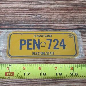 Vintage steel mini license plate Pennsylvania yellow sealed 1980s